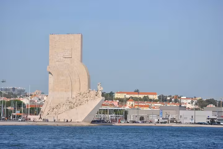Monument to the Discoveries seen from a Lisbon Old Town sailing cruise on the Tagus River with drink included