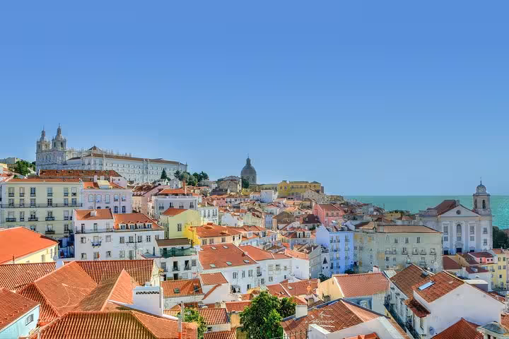 Scenic Lisbon skyline with historic architecture and ocean views, ideal for exploring on a guided tour from Madrid.