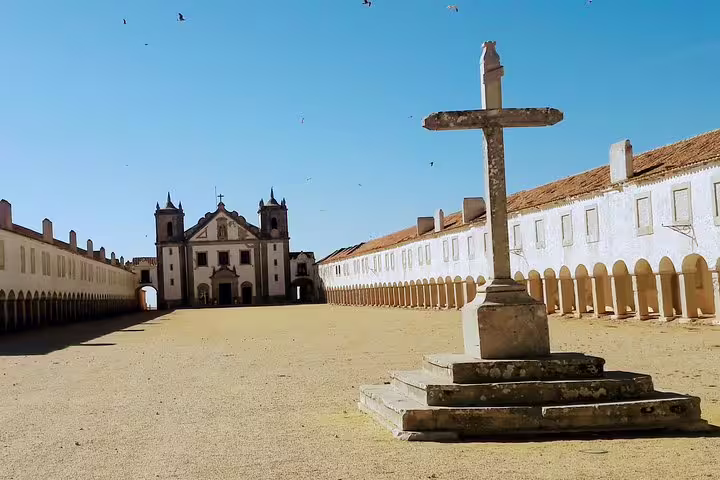 Stunning view of the historic Sanctuary of Our Lady of Cape Espichel, a highlight on Lisbon's South Sights & Wine Tour.