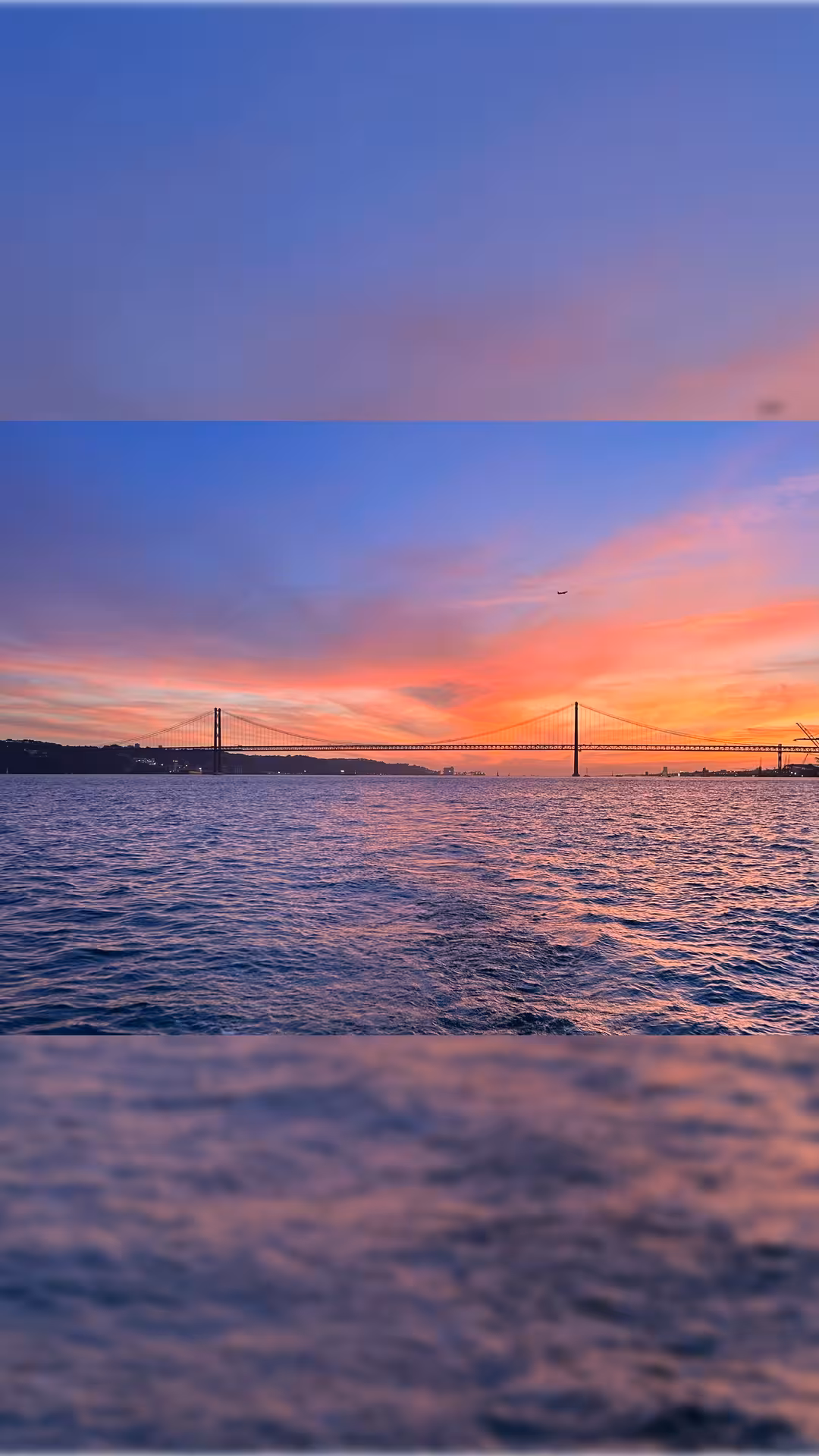 Lisbon sunset boat tour on the Tagus River with welcome drink, views of 25 de Abril Bridge at dusk