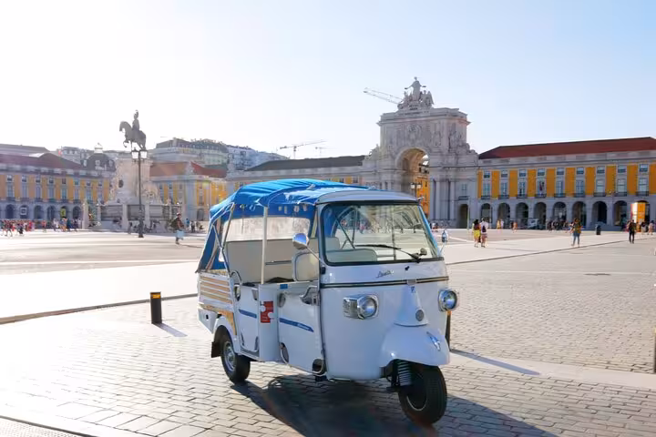 Private Lisbon tuk tuk at Praça do Comércio with Arco da Rua Augusta on a 2-hour historic city tour