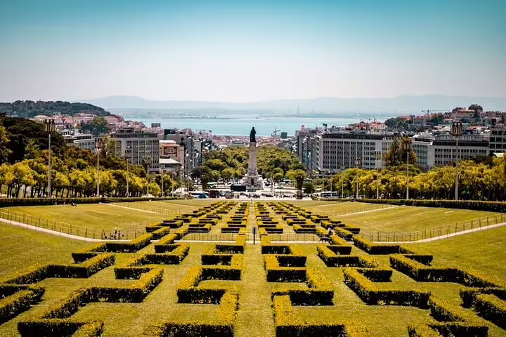 Experience panoramic views from Eduardo VII Park on a private Lisbon tuk tuk tour.
