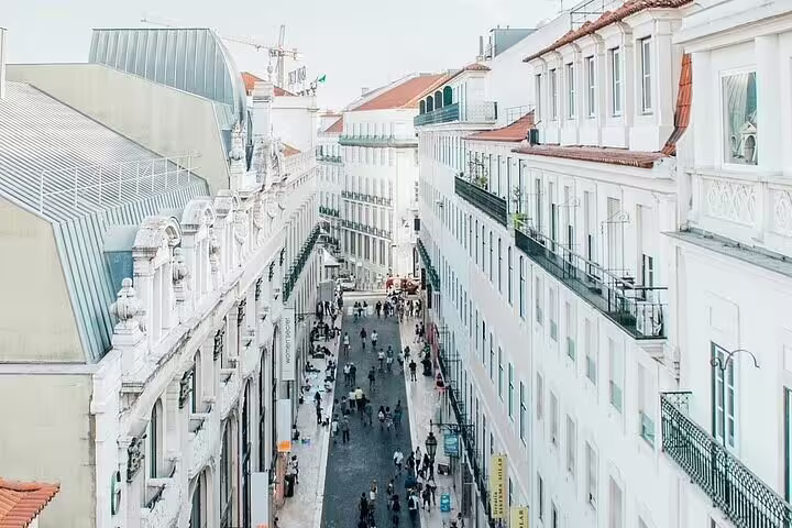 Bustling Rua Augusta in Lisbon's Baixa district, ideal for exploring on a full-day private Tuk Tuk tour.