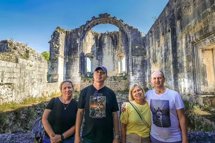 Tourists explore ancient ruins at a UNESCO World Heritage site near Lisbon, Portugal, on a 3-day cultural tour.