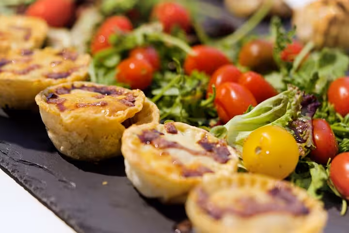 Portuguese custard tarts with fresh salad and cherry tomatoes, a tasty stop on Lisbon vintage Jeep tour