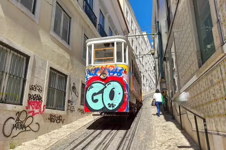 Discover Lisbon's iconic tramway with colorful graffiti on a small group walking tour.