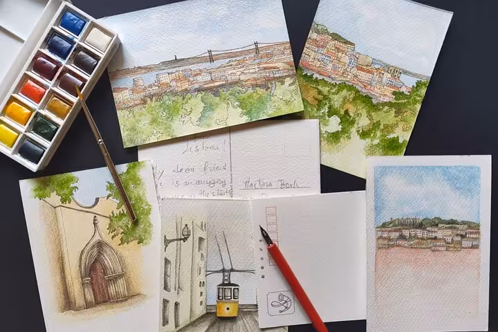 Watercolor Lisbon sketching tour artwork with paint set, brush, and cityscape studies of hidden viewpoints