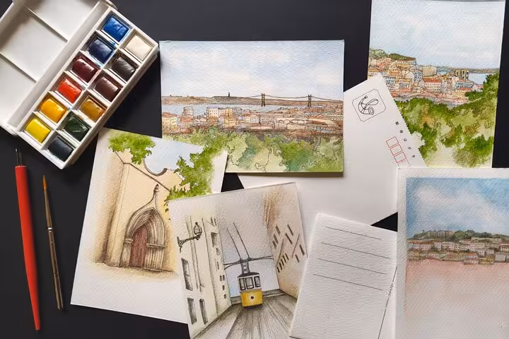 Watercolor sketching materials and Lisbon urban sketches, perfect for a guided hidden views art tour