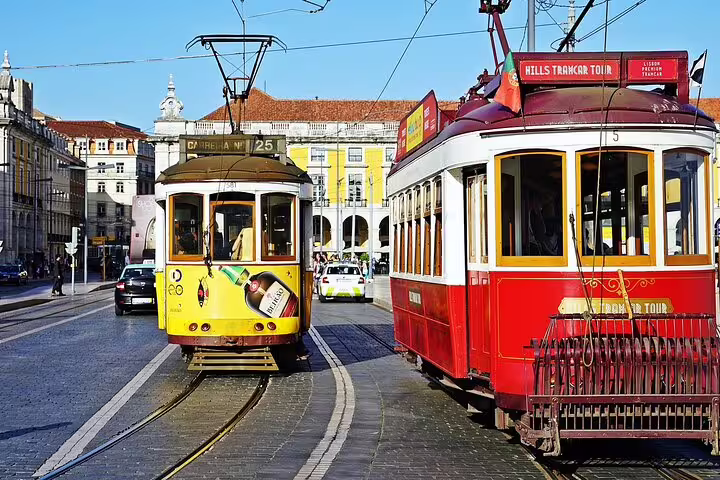 Classic Lisbon yellow and red trams in city center, ideal add-on after Faro to Lisbon private transfer