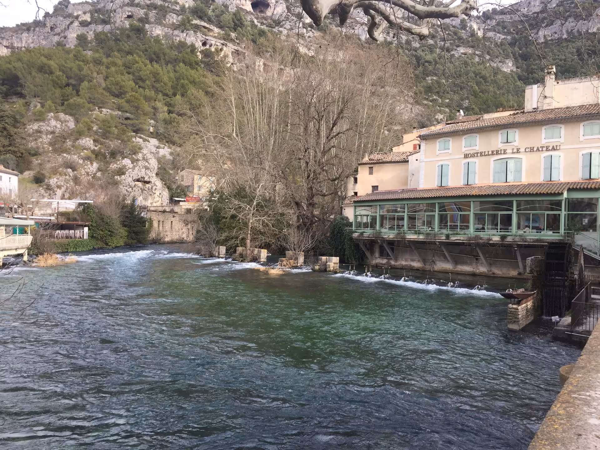 L'Isle-sur-la-Sorgue riverside mill and clear Sorgue waters, scenic stop on Provence villages day trip