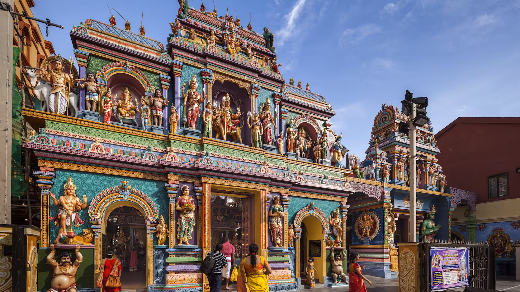 Discover a bustling market stall in Little India, Singapore, adorned with colorful traditional crafts and decorations.