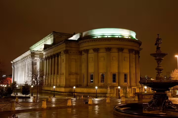 St George's Hall Liverpool illuminated at night with fountain in foreground
