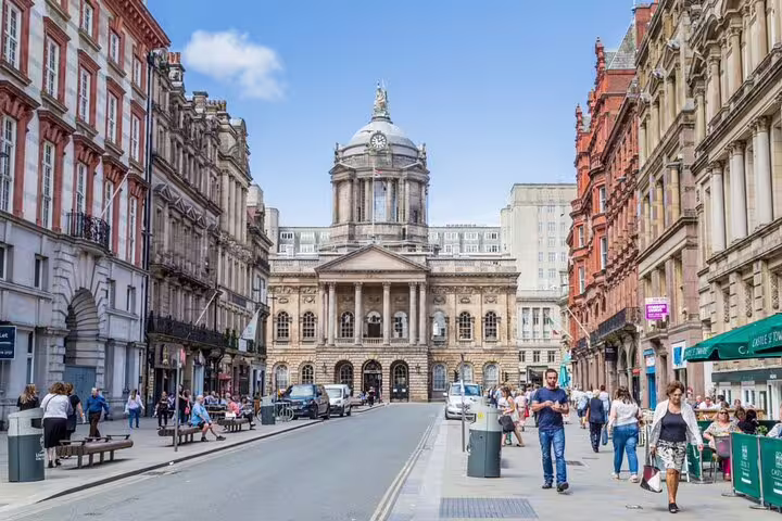 Liverpool city centre street with historic Town Hall dome and Georgian architecture on a sunny day