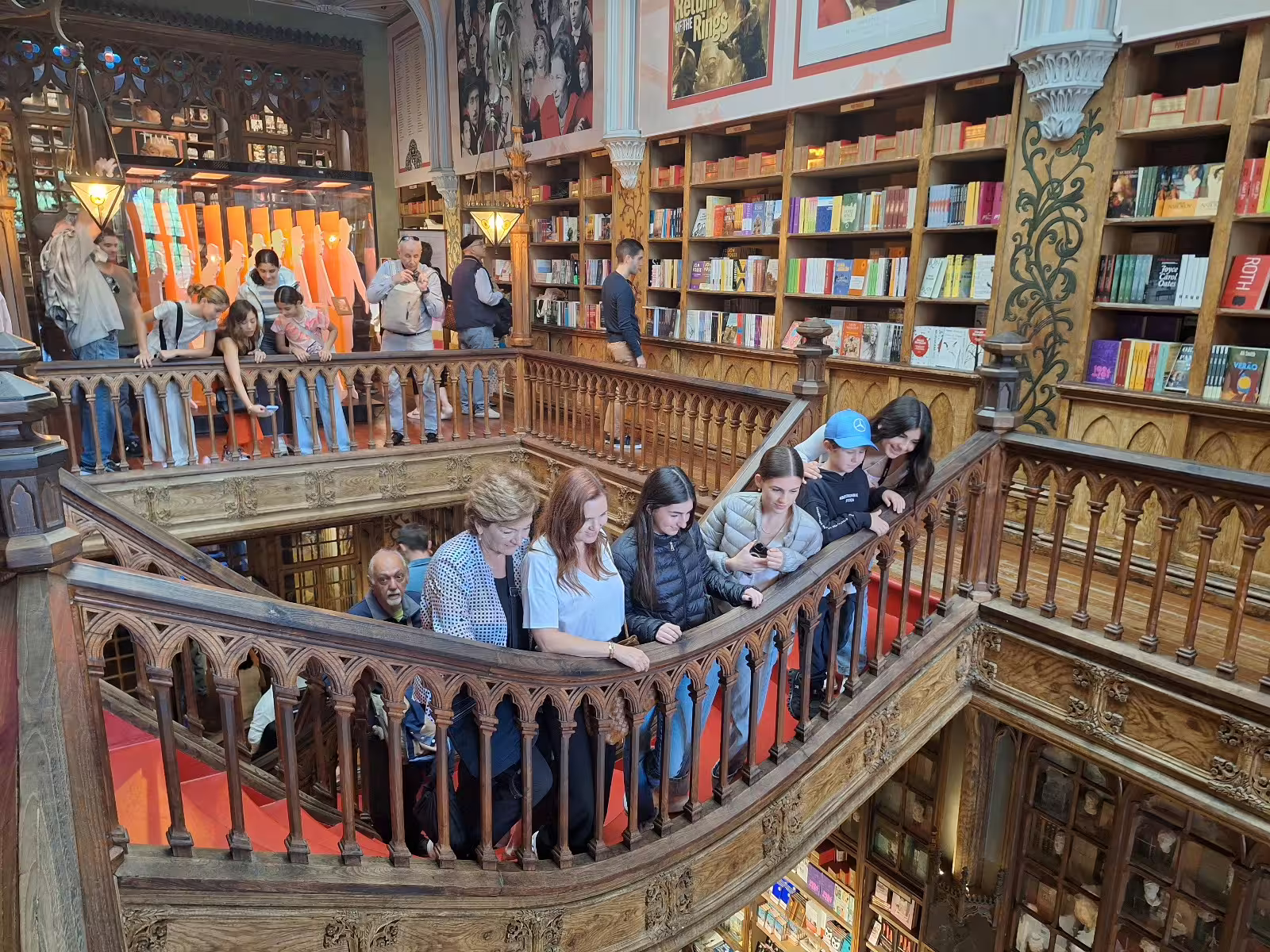 Visitors explore the ornate interior of Livraria Lello, a highlight of Porto's private afternoon tour, surrounded by books and history.