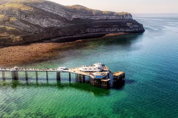 Llandudno pier over turquoise sea on the Portmeirion, Castles and Snowdonia day tour from North Wales