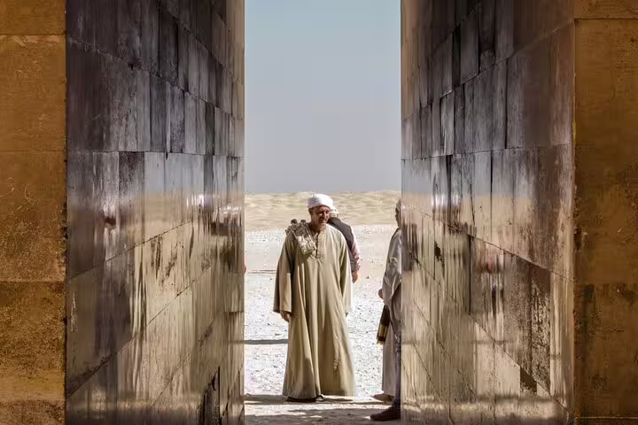Local guide at the Red Pyramid entrance in Dahshur, part of Cairo luxury pyramids, Saqqara and Memphis tour