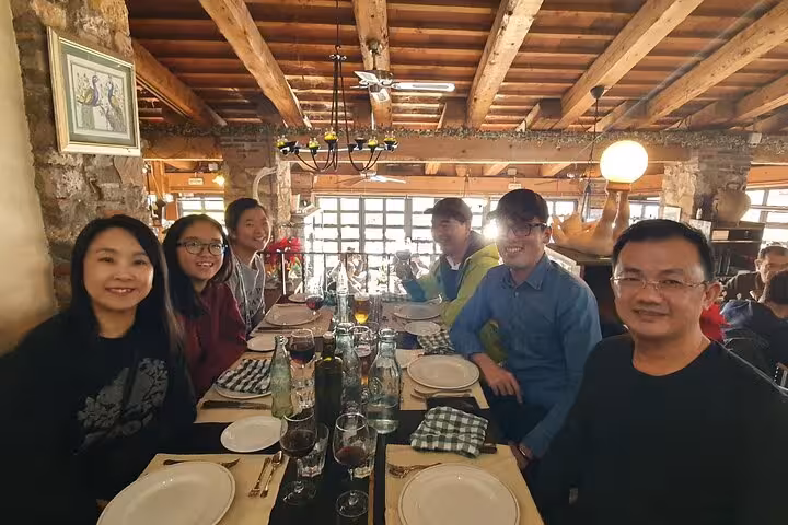 Guests dining together on a private Loch Ness Legends and Highland Capital tour, enjoying authentic Highland hospitality