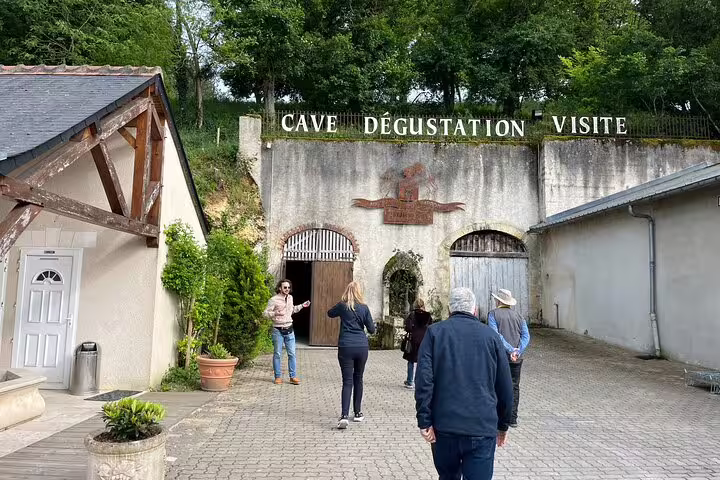 Group arriving at Loire Valley wine cave for guided vineyard visit and tasting, part of Loire castles tour with lunch