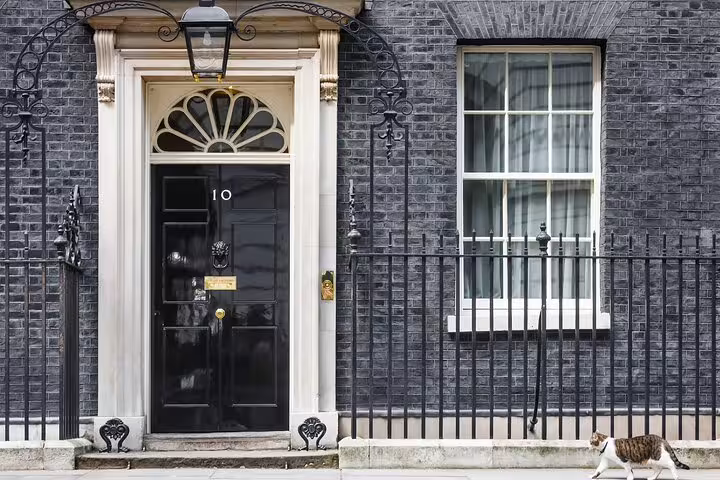 Famous black door of 10 Downing Street, seen during a London Highlights Private Bike Tour with included lunch experience.
