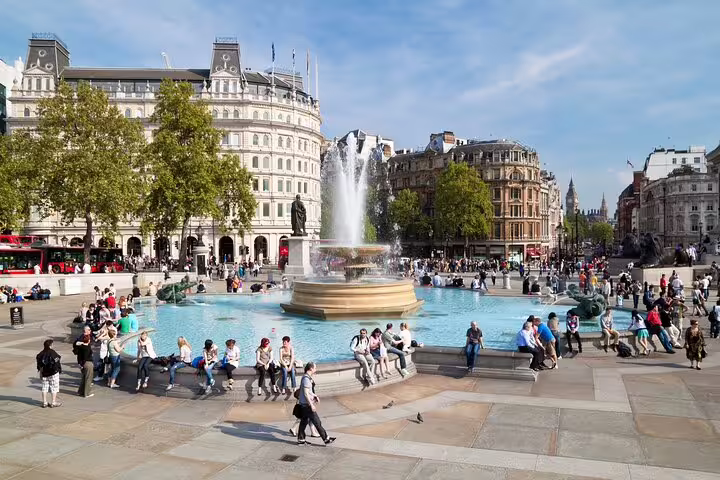 Visitors enjoying the vibrant atmosphere at Trafalgar Square, a highlight of the London Private Tour through Notting Hill and Markets.