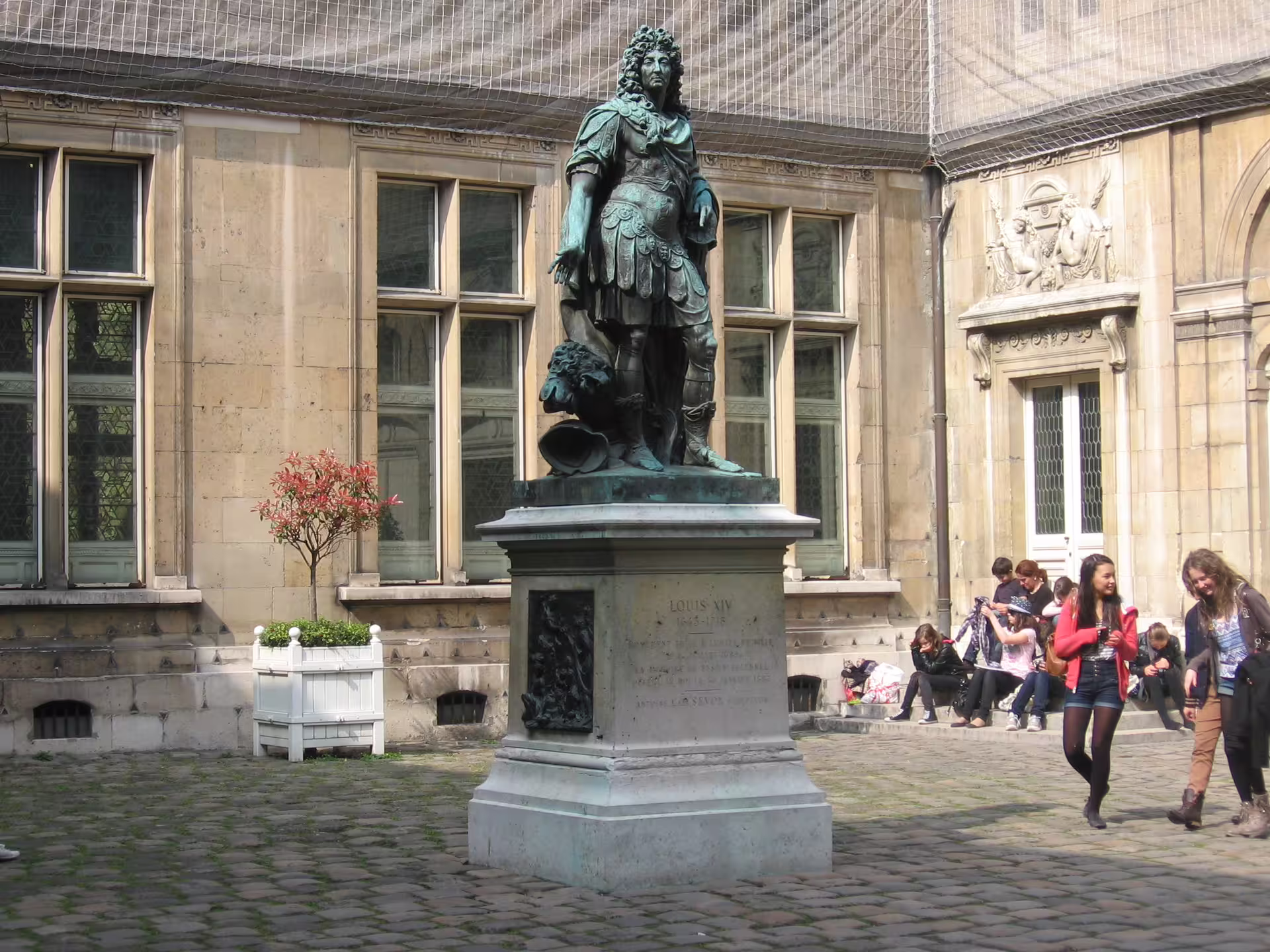 Bronze statue of Louis XIV in the courtyard of Musée Carnavalet in Le Marais, Paris