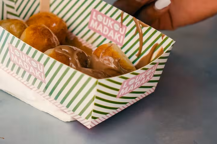 Loukoumadakia Greek honey doughnuts served on Athens food walk and taste tour for cruise travelers