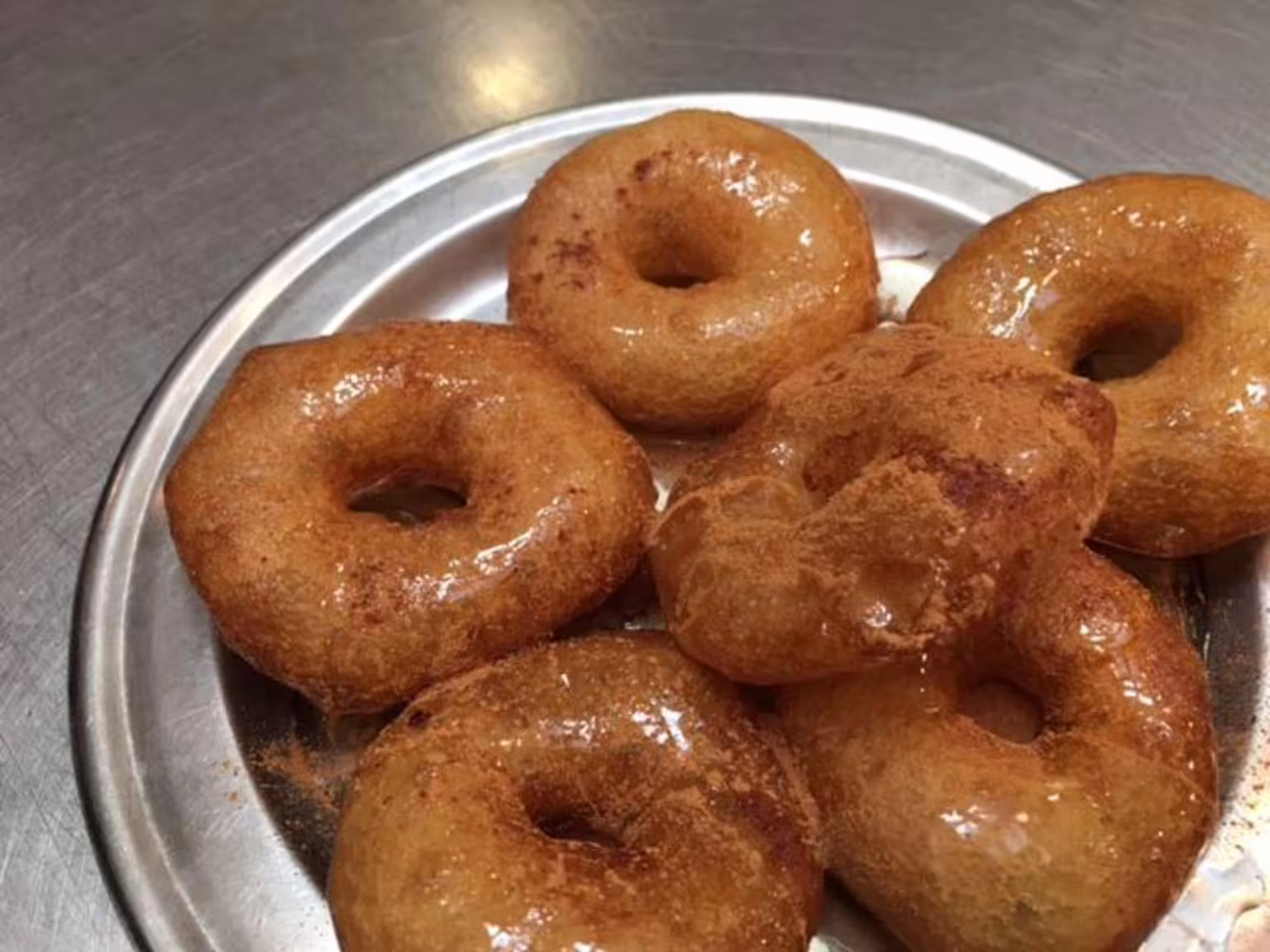Loukoumades Greek honey donuts on a plate, sweet tasting highlight on a gourmet Athens food tour