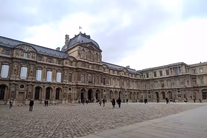 Louvre Museum courtyard in Paris before a guided tour, ideal for private guide and skip-the-line entry