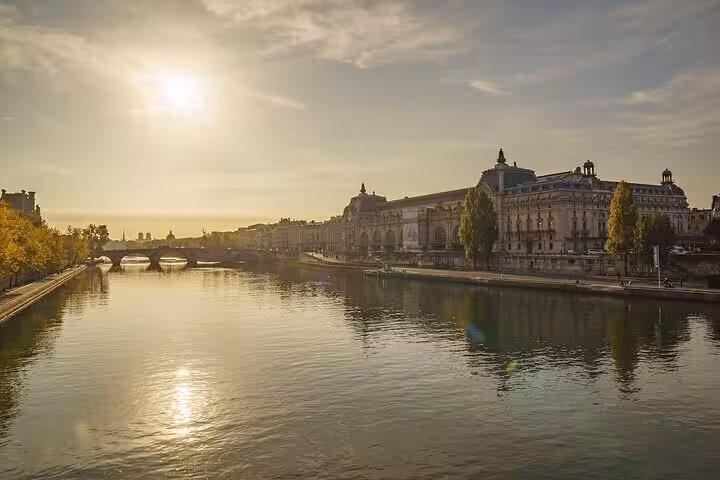 Sunrise over the Seine near the Louvre Museum, Paris, ideal for group, private, or solo guided tour experience