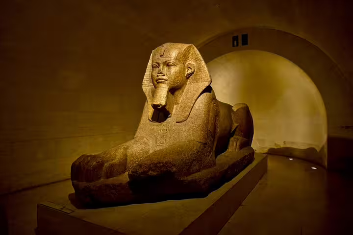 Majestic Sphinx statue in the Louvre's Egyptian Antiquities section, highlighting ancient art on a Mona Lisa tour.