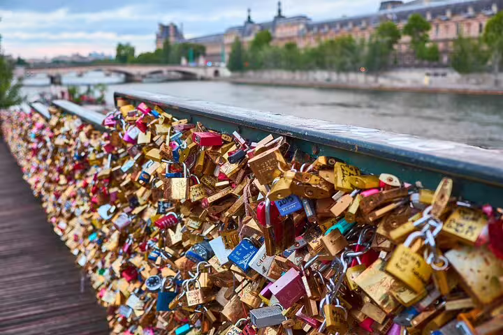 Love locks covering the railing of Pont des Arts bridge over the Seine River in Paris