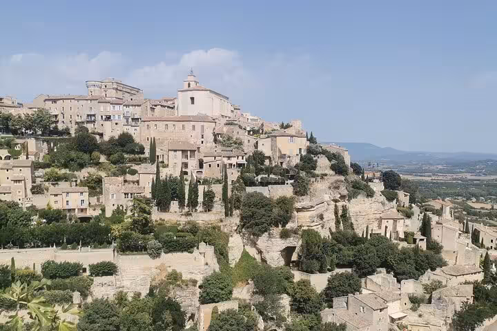 Panoramic view of a hilltop Luberon village in Provence, scenic highlight on South of France wine tour