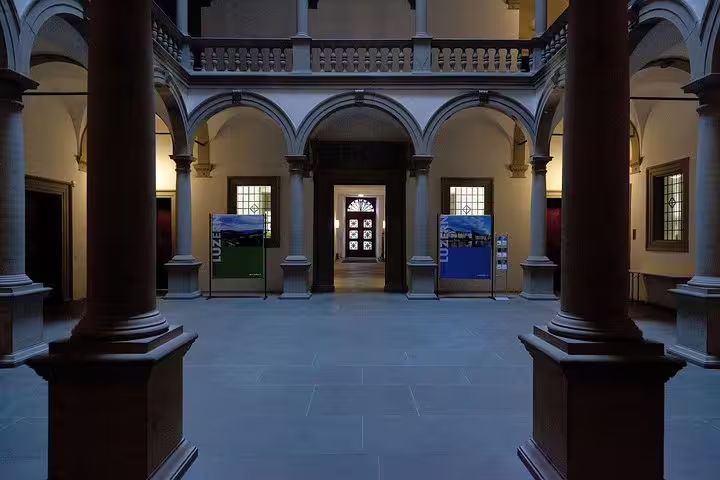 Elegant interior courtyard of a Lucerne landmark showcasing classic arches and historical architecture.