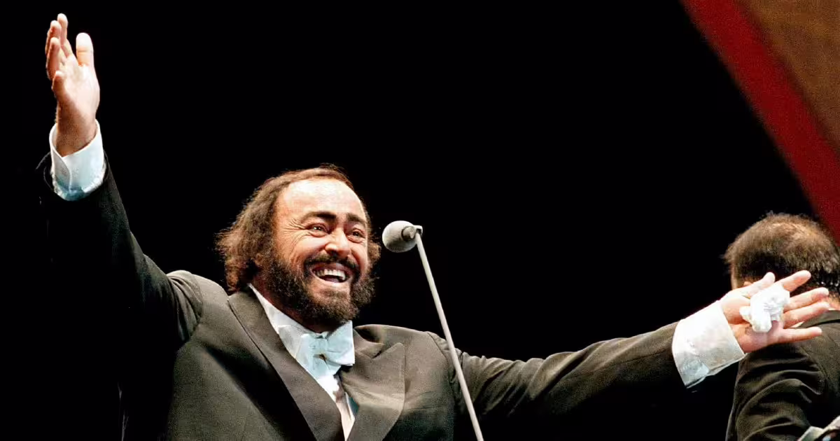 Luciano Pavarotti performing on stage, highlight of the Modena Pavarotti House Museum entrance ticket visit