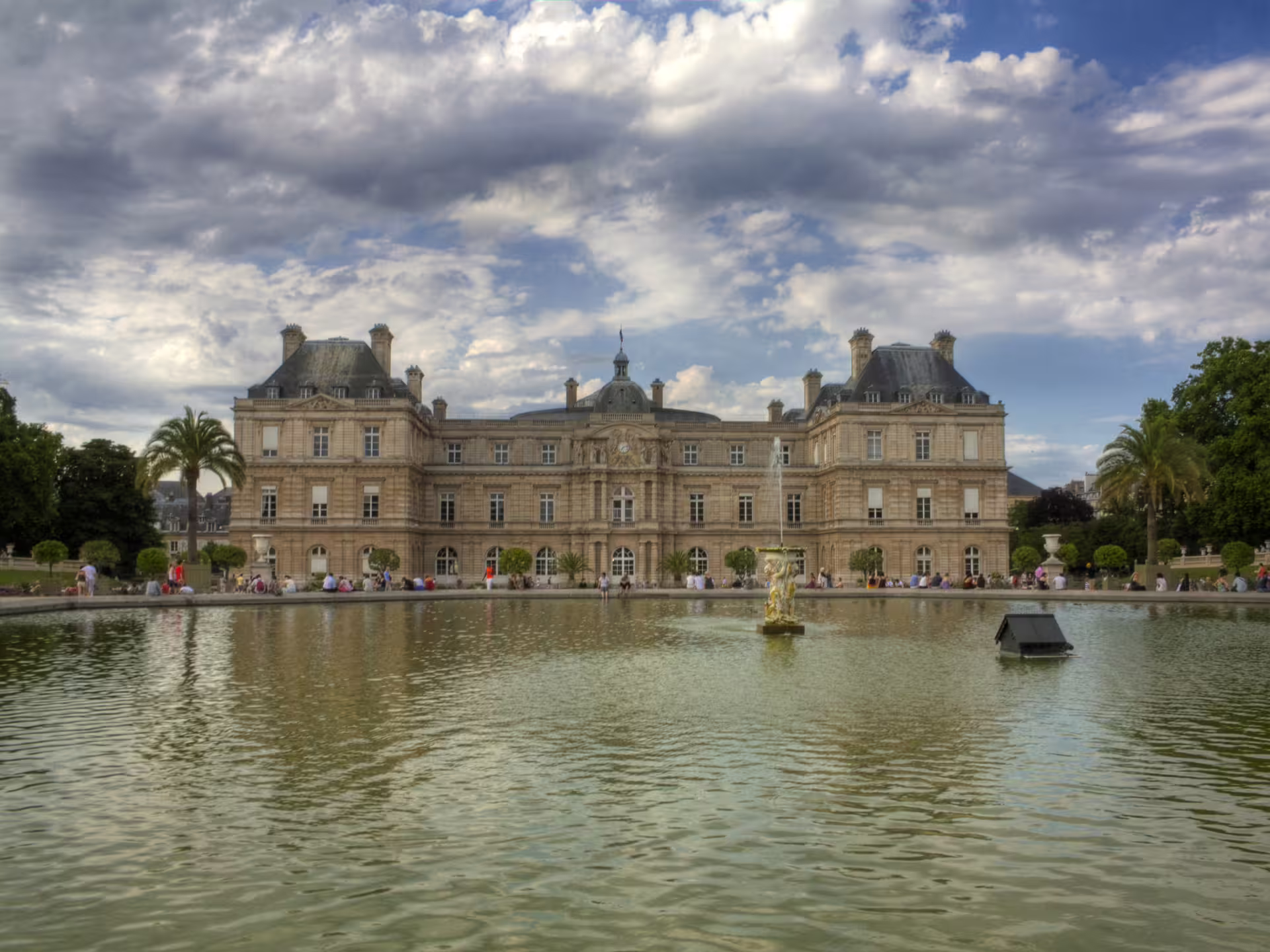 Luxembourg Palace reflected in the grand basin fountain at Jardin du Luxembourg, Paris