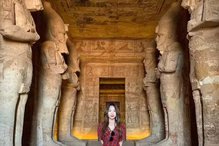 Visitor in Abu Simbel Great Temple hall with colossal statues, 4 days 3 nights Luxor to Abu Simbel short break