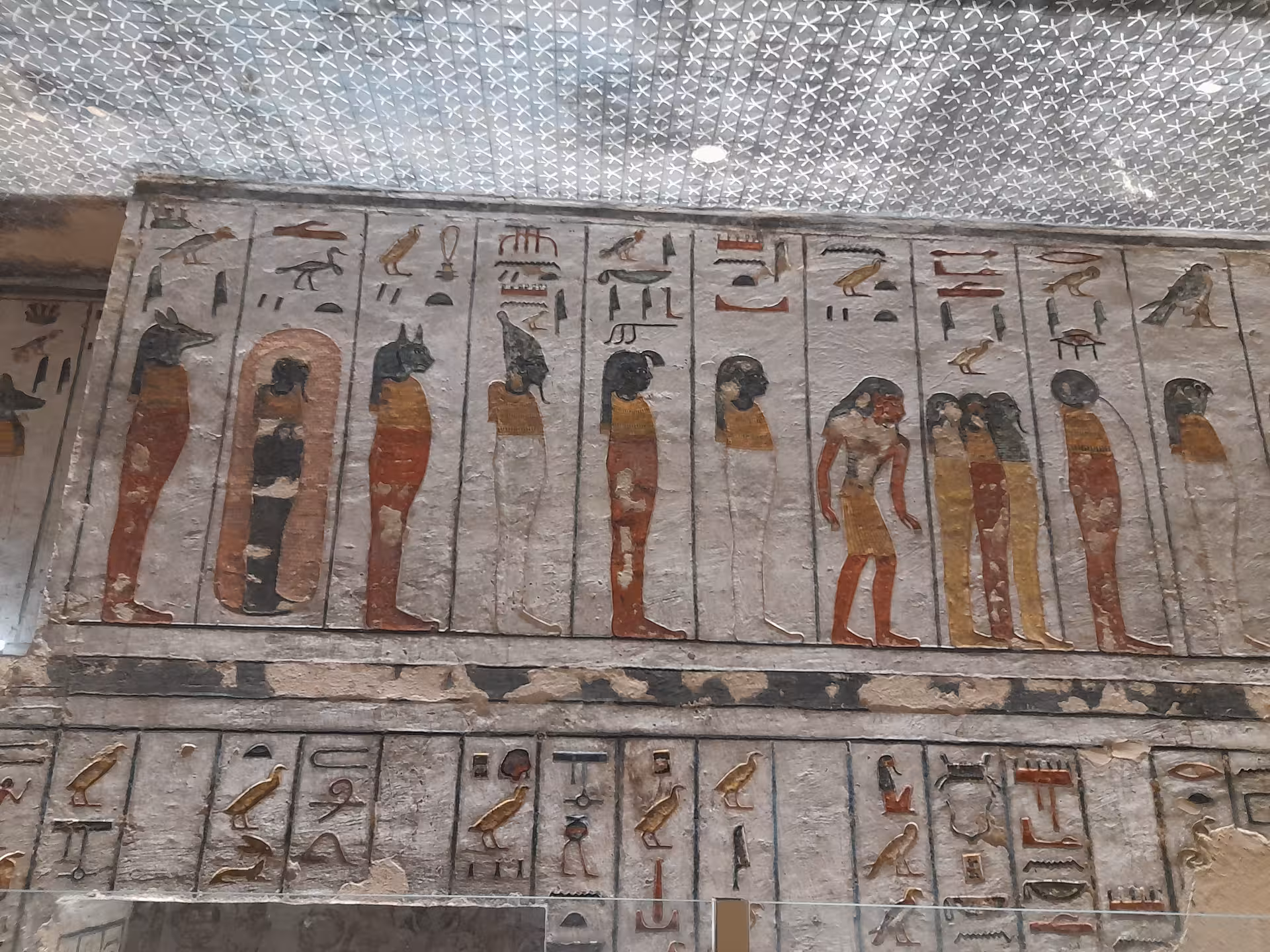 Marvel at detailed hieroglyphics and colorful depictions of deities on Luxor's ancient tomb walls.