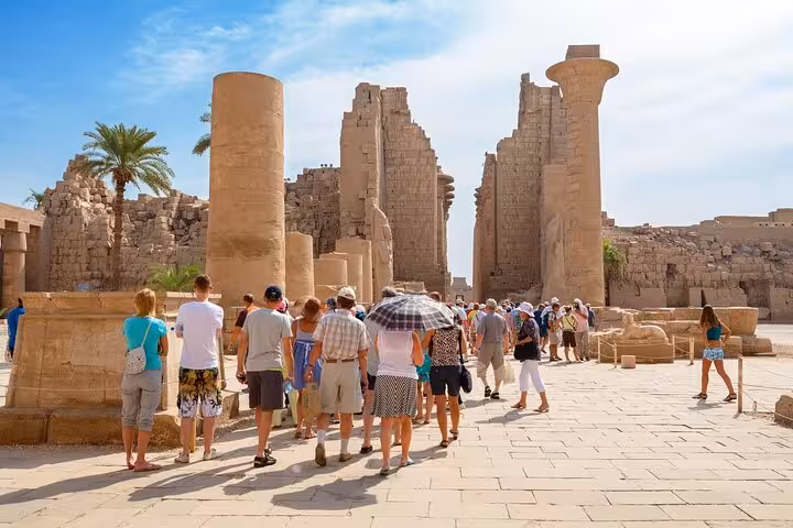 Visitors at Karnak Temple ruins in Luxor, Egypt on a private Luxor day tour with horse carriage ride option