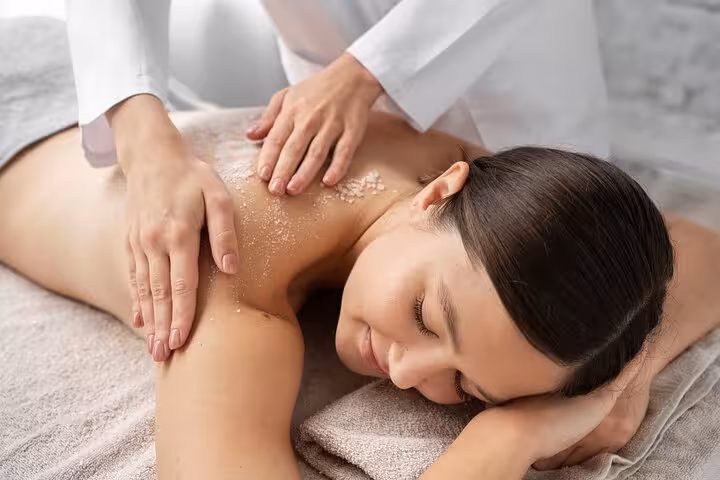 Woman enjoying exfoliating body scrub during 2-hour Luxor hammam spa, Turkish bath ritual and massage session
