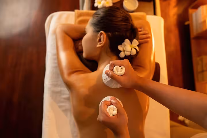 Luxor hammam spa massage with herbal compress on back, 2-hour relaxation treatment in warm wellness room
