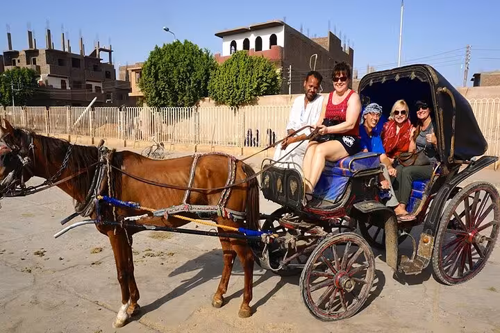 Tourists ride a horse-drawn carriage in Luxor city tour, Egypt, private sightseeing experience