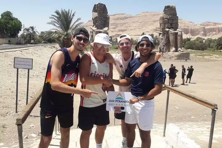 Travelers at Luxor Colossi of Memnon on Nile East and West Bank tour to Karnak and Hatshepsut temples