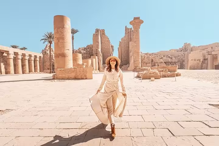 Traveler walking through Karnak Temple courtyard in Luxor on a private day tour with flexible itinerary and guide