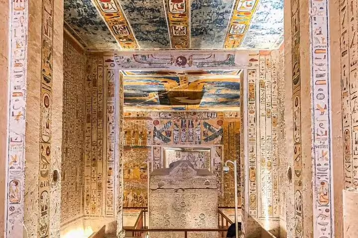 Ancient sarcophagus chamber with hieroglyph walls in Luxor on private sleeper train tour from Cairo