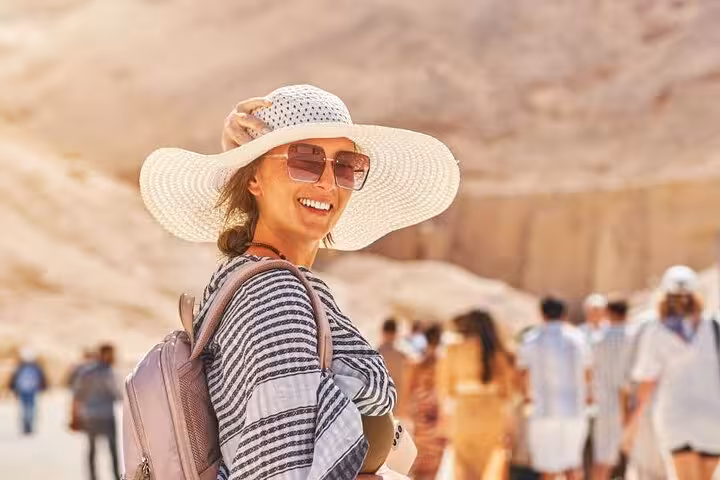 Traveler in sun hat at Luxor on small group Cairo to Luxor flight tour, Valley of the Kings day trip