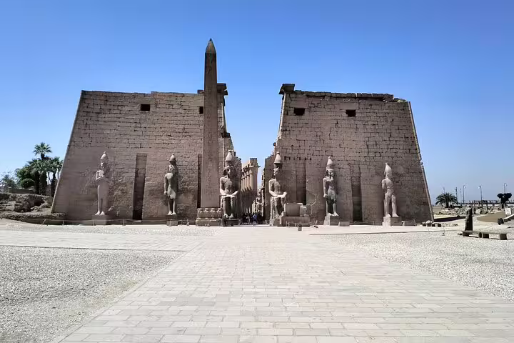 Entrance of Luxor Temple with towering pylons and statues, must-see stop on 14-day Egypt Nile Sahara desert tour
