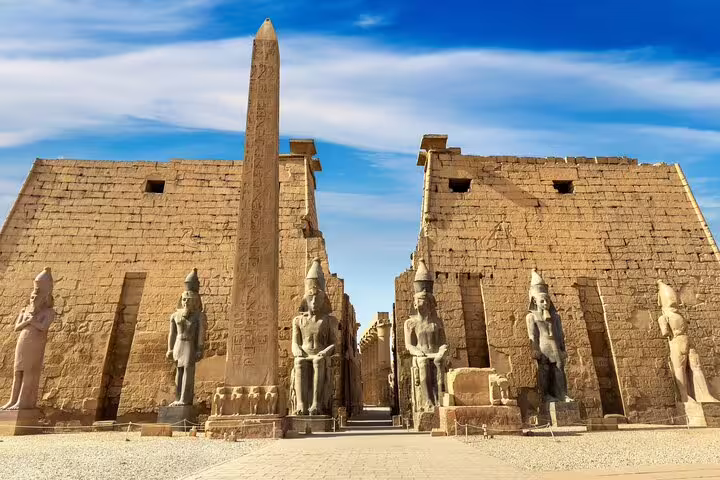 Luxor Temple entrance with obelisk and statues, Luxor historical day tour by bus from Hurghada