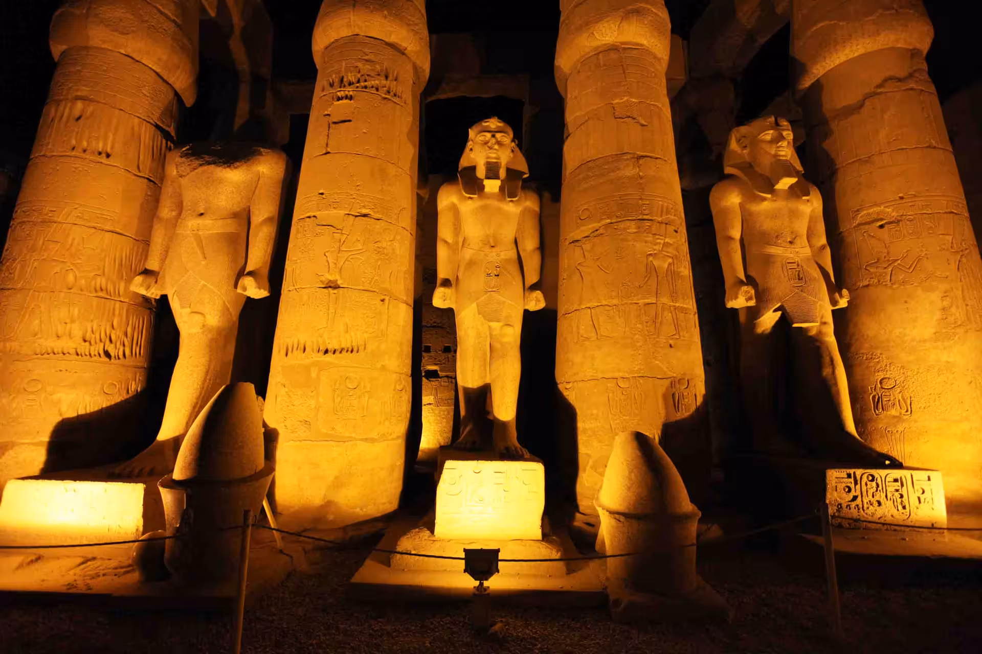 Illuminated statues and columns at Luxor Temple at night, highlight of Nile Adventure felucca cruise itinerary