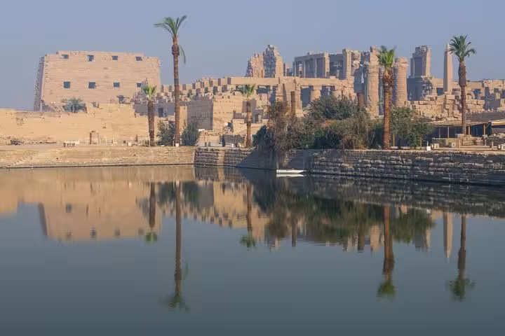 Luxor Temple skyline reflected on the Nile at sunset, scenic view for Karnak and Luxor Temple day tour