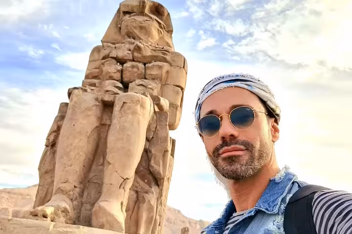 Traveler selfie by the Colossi of Memnon on a private full-day Luxor tour from Hurghada, Egypt
